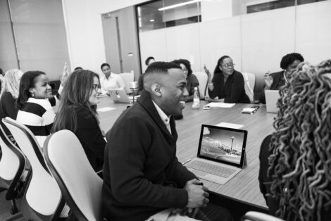 People Laughing At Conference Table